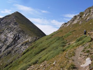 Approaching Comanche Peak.  We begin to see the steep grassy slope on the back side.